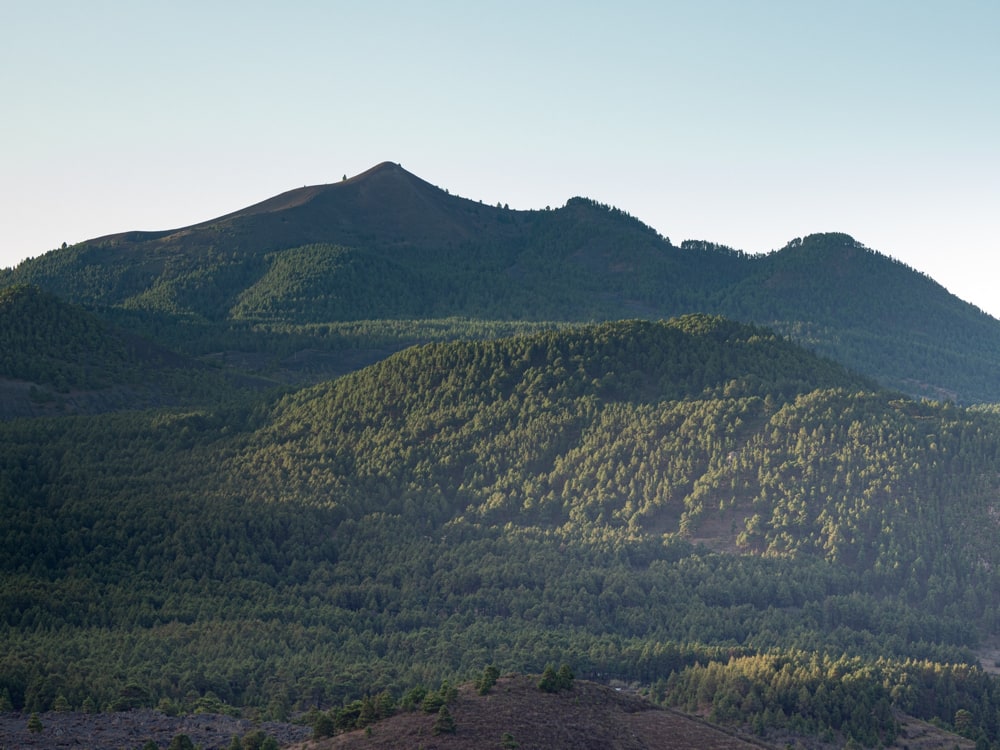 View of Pico Birigoyo just as the sun rises over the Cumbre Nueva lighting it from the left side