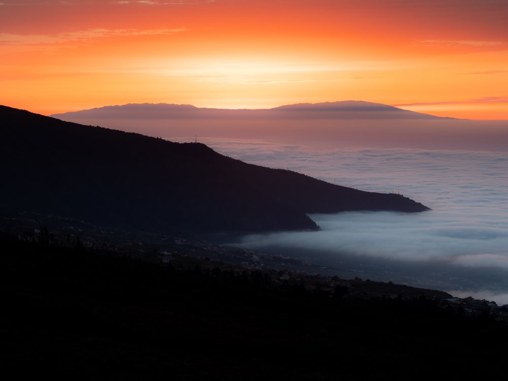 Detail shot of the setting sun behind La Palma with the valley of La Orotava in front.