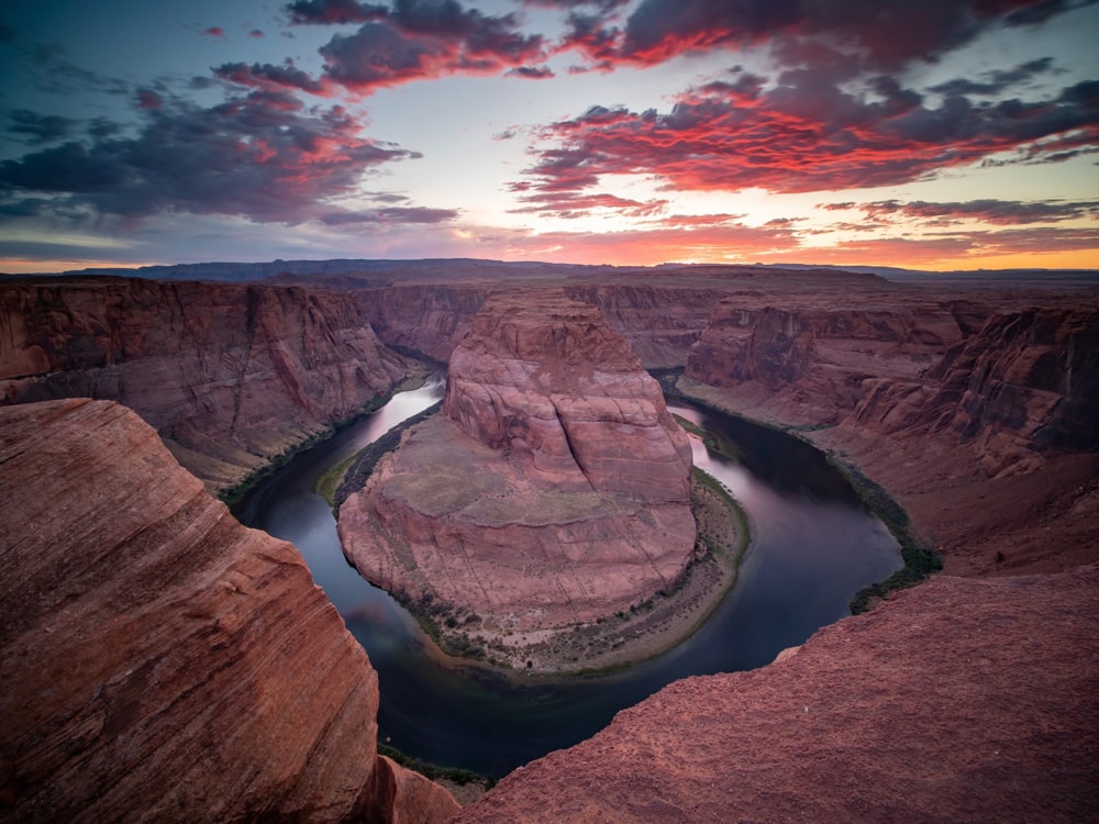 View of Horseshoe Bend as the sun sets in behind the bend